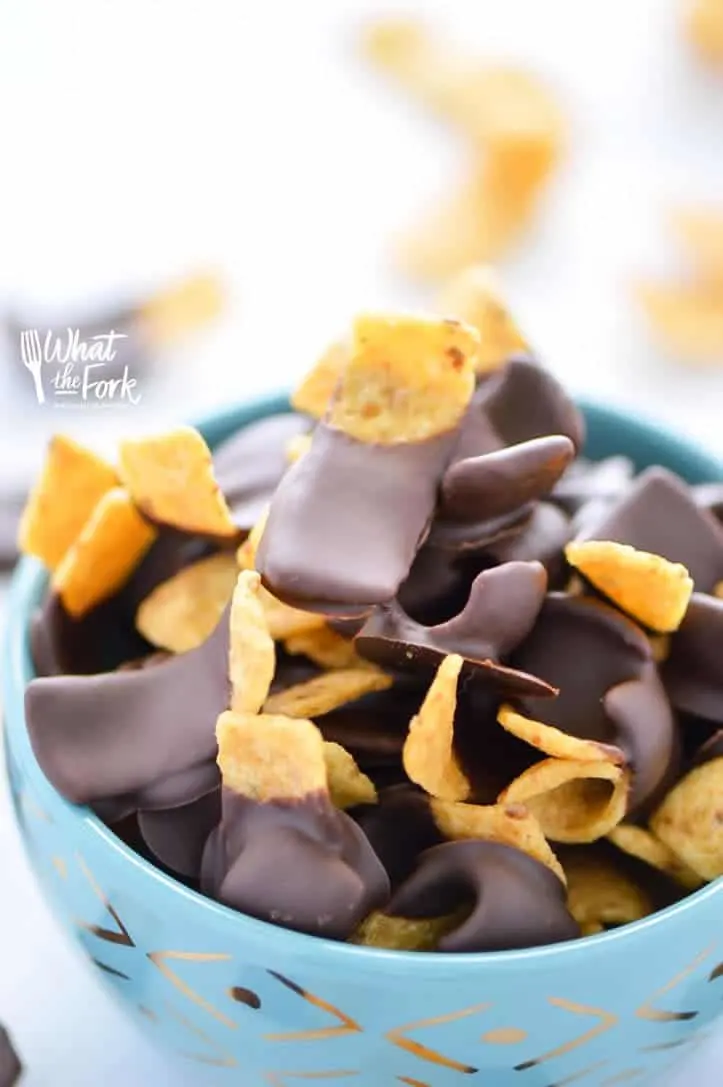 Chocolate Dipped Fritos (aka Fritos Jets) are a delicious salty-sweet snack! They're great for parties! Easy recipe from @whattheforkblog | whattheforkfoodblog.com | gluten free snacks | appetizers | chocolate covered | sweet and salty | chips | Sponsored by Frito Lay