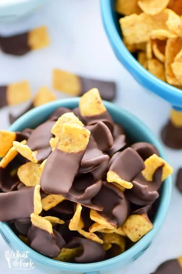 Chocolate Dipped Fritos (aka Fritos Jets) are a delicious salty-sweet snack! They're great for parties! Easy recipe from @whattheforkblog | whattheforkfoodblog.com | gluten free snacks | appetizers | chocolate covered | sweet and salty | chips | Sponsored by Frito Lay | snack foods | easy snacks | no-bake recipes