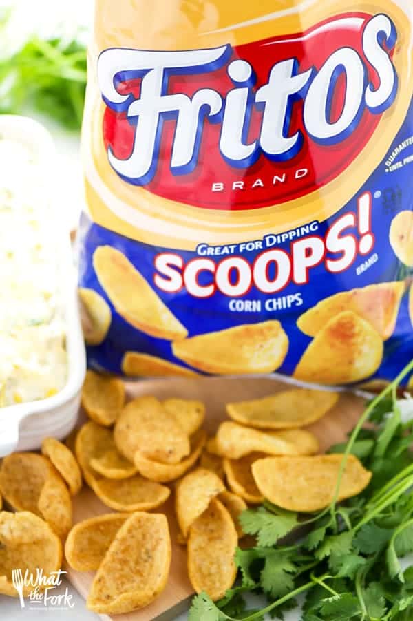 Quick and easy Slow Cooker Corn Dip makes a great party snack or appetizer! It comes together in 5 minutes and is ready to serve in an hour, it's a great hands-off dish! Sponsored by @fritolay #sayyestosummer | Recipe from @whattheforkblog | whattheforkfoodblog.com | gluten free appetizers | game day food | crock pot dip recipes | easy dip recipes | easy cheesy dips | corn dip in the crock pot | hot corn dip | cheesy corn dip