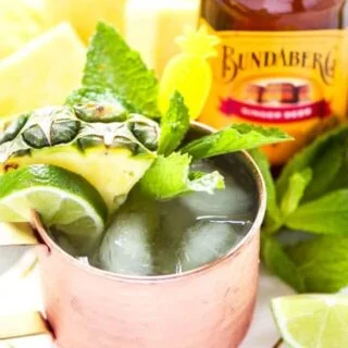 This simple Pineapple Moscow Mule recipe is SO easy. This drink is so refreshing and perfect for summer. Can easily be made without alcohol too. Recipe from @whattheforkblog | Sponsored by Bundaberg Brewed Drinks | whattheforkfoodblog.com | summer drinks | easy cocktail recipes | drinks with pineapple | vodka | cocktail recipes