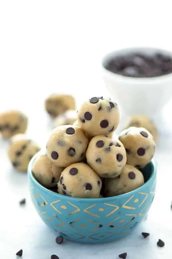 Gluten Free Edible Chocolate Chip Cookie Dough (egg free recipe with a dairy free + vegan option). No bake chocolate chip cookie dough bites. Recipe from @whattheforkblog | whattheforkfoodblog.com | easy gluten free desserts | no-bake recipes | summer desserts | edible cookie dough | gluten free dairy free recipes #glutenfree #vegan #cookiedough #chocolatechip #chocolate