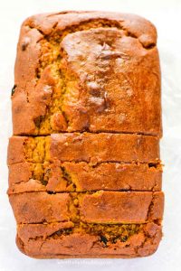 This is the best gluten free pumpkin recipe! It's a classic made with raisins (which are optional) and made with full can of pumpkin. This is a fall must-make! Easy gluten free recipe from @whattheforkblog | whattheforkfoodblog.com | pumpkin recipes | gluten free bread recipes | classic pumpkin bread | gluten free baking | gluten free breakfast recipes | quick bread recipes | pumpkin puree | dairy free recipes | recipes with pumpkin