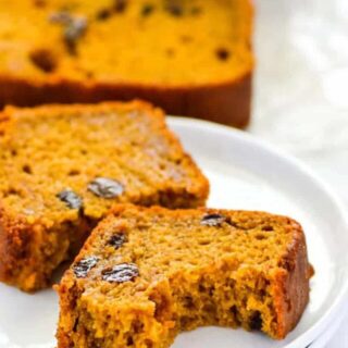 This is the best gluten free pumpkin recipe! It's a classic made with raisins (which are optional) and made with full can of pumpkin. This is a fall must-make! Easy gluten free recipe from @whattheforkblog | whattheforkfoodblog.com | pumpkin recipes | gluten free bread recipes | classic pumpkin bread | gluten free baking | gluten free breakfast recipes | quick bread recipes | pumpkin puree | dairy free recipes | recipes with pumpkin