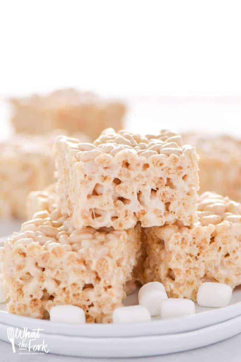 Classic Gluten Free Rice Krispies Treats - these are a crowd-pleasing favorite! They're so easy to make and have such a great gooey marshmallow to cereal ratio - they're simply addicting! Dessert recipe from @whattheforkblog | whattheforkfoodblog.com | gluten free desserts | no-bake dessert recipes | how to make rice krispie treats | gluten free no-bake recipes | easy dessert recipes | homemade rice krispies treats | marshmallow recipes | desserts for a bake sale | classic dessert recipes