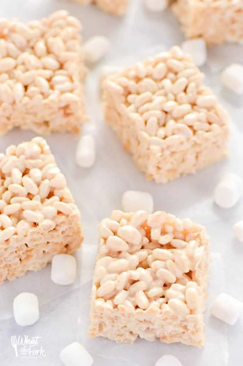 Classic Gluten Free Rice Krispies Treats - these are a crowd-pleasing favorite! They're so easy to make and have such a great gooey marshmallow to cereal ratio - they're simply addicting! Dessert recipe from @whattheforkblog | whattheforkfoodblog.com | gluten free desserts | no-bake dessert recipes | how to make rice krispie treats | gluten free no-bake recipes | easy dessert recipes | homemade rice krispies treats | marshmallow recipes | desserts for a bake sale | classic dessert recipes