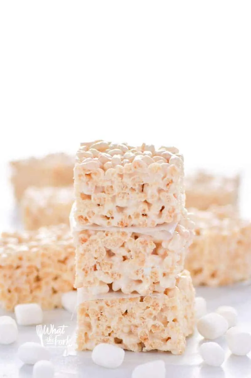 Classic Gluten Free Rice Krispies Treats - these are a crowd-pleasing favorite! They're so easy to make and have such a great gooey marshmallow to cereal ratio - they're simply addicting! Dessert recipe from @whattheforkblog | whattheforkfoodblog.com | gluten free desserts | no-bake dessert recipes | how to make rice krispie treats | gluten free no-bake recipes | easy dessert recipes | homemade rice krispies treats | marshmallow recipes | desserts for a bake sale | classic dessert recipes