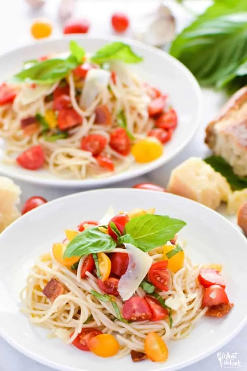 30-Minute Gluten-Free Summer Spaghetti with fresh tomatoes, garlic, basil, bacon, and parmesan cheese.