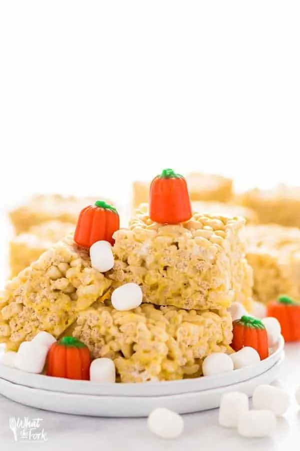 Pumpkin Spice Rice Krispies Treats are the perfect fall flavored no-bake treat. They've got that pumpkin spice flavor you love without having to turn on the oven. They're really easy to make too! Recipe from @whattheforkblog | whattheforkfoodblog.com | easy gluten free desserts | no-bake dessert recipes | homemade rice krispies treats | pumpkin spice recipes | fall recipes | easy dessert recipes | flavors for Rice Krispies Treats | homemade dessert recipes | updated classics