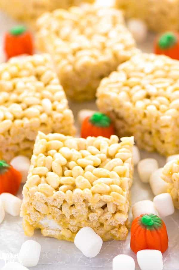 Pumpkin Spice Rice Krispies Treats are the perfect fall flavored no-bake treat. They've got that pumpkin spice flavor you love without having to turn on the oven. They're really easy to make too! Recipe from @whattheforkblog | whattheforkfoodblog.com | easy gluten free desserts | no-bake dessert recipes | homemade rice krispies treats | pumpkin spice recipes | fall recipes | easy dessert recipes | flavors for Rice Krispies Treats | homemade dessert recipes | updated classics