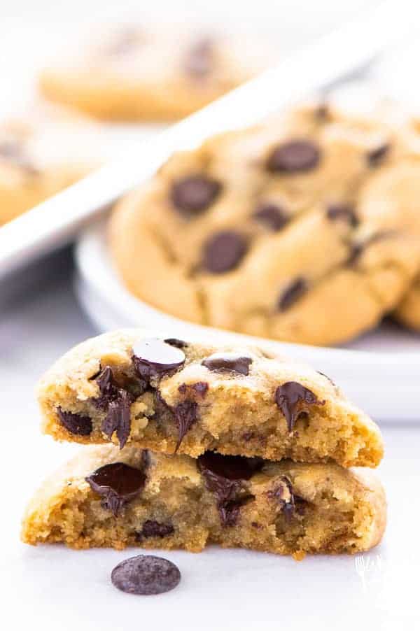 Baked GF chocolate chip cookies stacked on top of each other