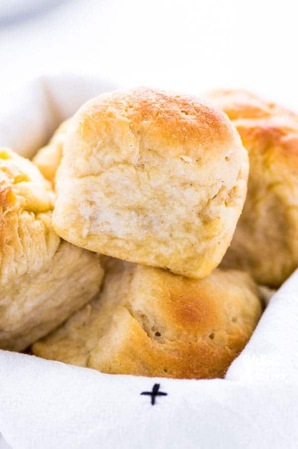 These gluten free dinner rolls are soft with a nice chew to it - just like regular wheat rolls! If you've been missing real dinner rolls, try this recipe! Plus, they’re much easier to make than you’d think! From @whattheforkblog | whattheforkfoodblog.com | gluten free bread recipes | gluten free rolls | yeast rolls | gluten free yeast rolls | gluten free bread recipes #glutenfree #dinnerrolls #yeastrolls #glutenfreebaking #easyrecipes #glutenfreerecipes #glutenfreebread #bread #recipes