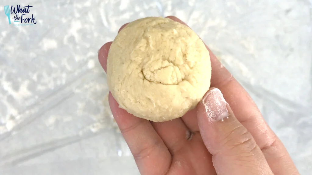 Finish forming the dough to a well rounded dough ball. (best results if you squish/flatten the dough in your hands first THEN roll into a ball)