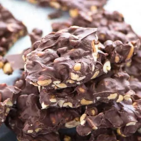 Crock Pot Bark with Salted Peanuts makes a great homemade holiday gift. That salty-sweet combo is irresistible! Recipe from @whattheforkblog | whattheforkfoodblog.com | crock pot candy recipe | slow cooker recipes | homemade candy | easy candy recipes | homemade candy without a thermometer | nut clusters | #candy #glutenfree #crockpot #slowcooker #chocolate #easyrecipes #Christmas #dessert