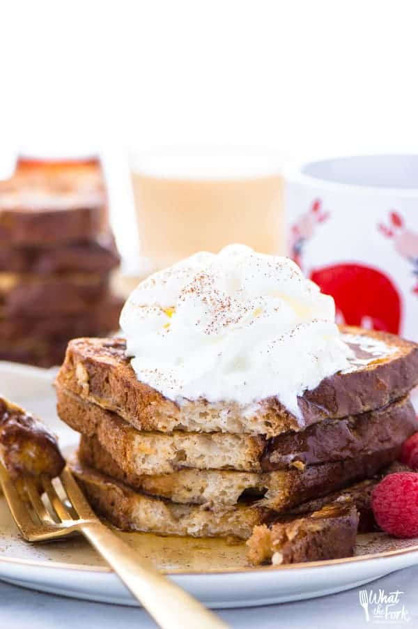 This Gluten Free Eggnog French Toast is the perfect breakfast during the holiday season. You can make it ahead too and reheat it for your holiday brunch! For dairy free, use non-dairy eggnog. Recipe from @whattheforkblog | whattheforkfoodblog.com | recipes for Christmas brunch | gluten free breakfast recipes | easy French toast recipes | #Christmas #frenchtoast #breakfast #glutenfree #easyrecipes #recipe #eggnog #brunch