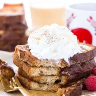 This Gluten Free Eggnog French Toast is the perfect breakfast during the holiday season. You can make it ahead too and reheat it for your holiday brunch! For dairy free, use non-dairy eggnog. Recipe from @whattheforkblog | whattheforkfoodblog.com | recipes for Christmas brunch | gluten free breakfast recipes | easy French toast recipes | #Christmas #frenchtoast #breakfast #glutenfree #easyrecipes #recipe #eggnog #brunch