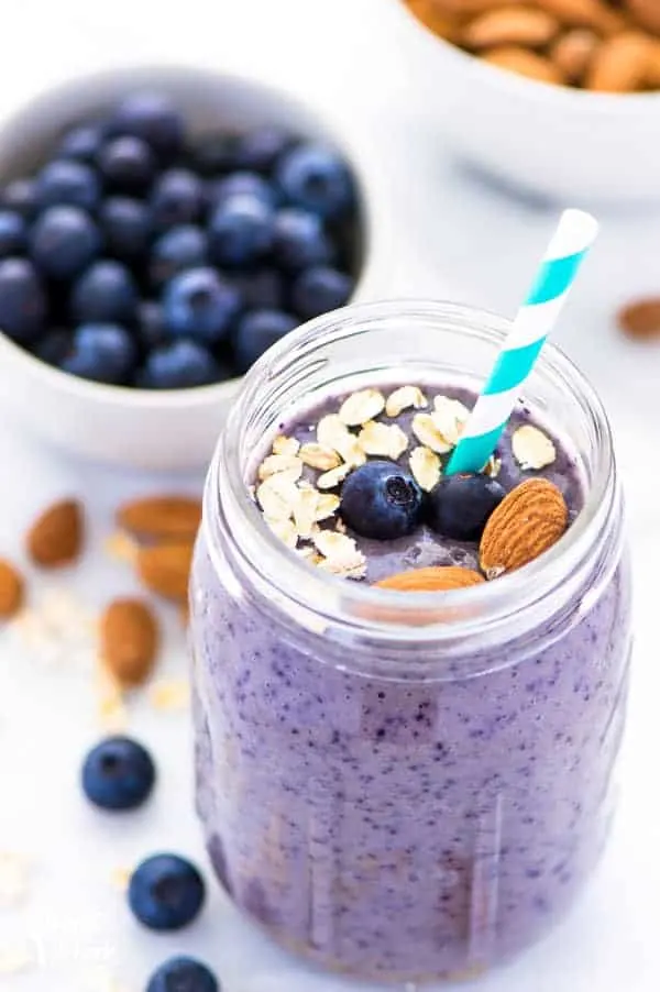 Vibrant and beautiful blueberry almond oatmeal smoothies - these are as tasty and filling as they are pretty! The blueberry almond flavor combo is fantastic - it reminds me a bit of blueberry muffins! Healthy smoothie recipe from @whattheforkblog | whattheforkfoodblog.com | healthy breakfast recipes | recipes for smoothies | #healthy #smoothies #breakfast #recipe #easyrecipes #oatmeal #oatmealsmoothies #glutenfree