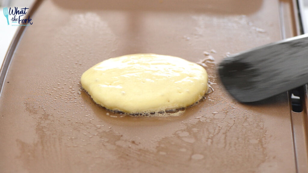 Cook on the first side and then flip when little bubbles start to appear on the top of the pancakes. Cook until the other side is browned and cooked through.