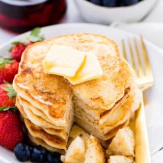 These gluten free pancakes are light, fluffy, and truly the best! They're so easy to make, can be made dairy free, they're naturally sweetened, and they freeze well! Recipe via @whattheforkblog | whattheforkfoodblog.com | gluten free breakfast recipes | fluffy gluten free pancakes | easy gluten free recipes | gluten free brunch | #glutenfree #easyrecipes #pancakes #breakfast #dairyfree #naturallysweetened