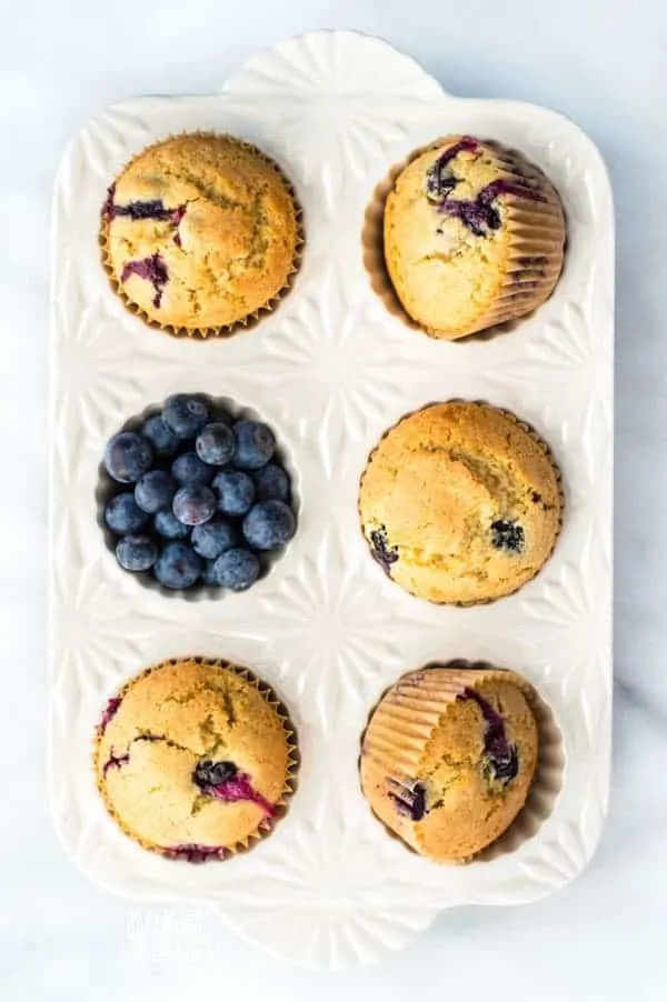 This is a really easy recipe for gluten free blueberry muffins. They’re so tender and full of cinnamon flavor - they’ll quickly become a go-to breakfast recipe! They freeze well too so go ahead and make a double batch! They’re great for busy mornings. From @whattheforkfblog | whattheforkfoodblog.com | gluten free breakfast recipes | gluten free muffin recipes | homemade muffins | #glutenfree #dairyfree #muffins #breakfast #easyrecipes