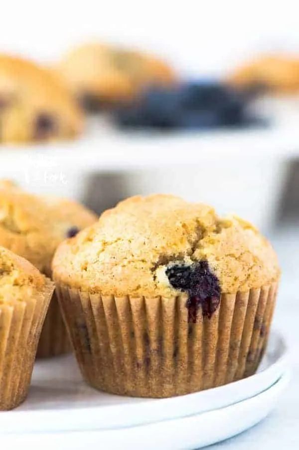 This is a really easy recipe for gluten free blueberry muffins. They’re so tender and full of cinnamon flavor - they’ll quickly become a go-to breakfast recipe! They freeze well too so go ahead and make a double batch! They’re great for busy mornings. From @whattheforkfblog | whattheforkfoodblog.com | gluten free breakfast recipes | gluten free muffin recipes | homemade muffins | #glutenfree #dairyfree #muffins #breakfast #easyrecipes