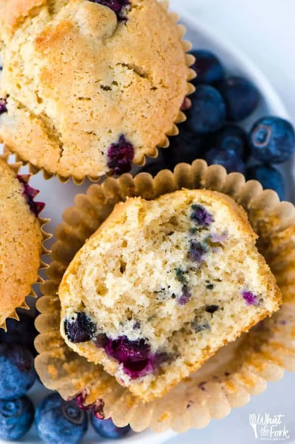 This is a really easy recipe for gluten free blueberry muffins. They’re so tender and full of cinnamon flavor - they’ll quickly become a go-to breakfast recipe! They freeze well too so go ahead and make a double batch! They’re great for busy mornings. From @whattheforkfblog | whattheforkfoodblog.com | gluten free breakfast recipes | gluten free muffin recipes | homemade muffins | #glutenfree #dairyfree #muffins #breakfast #easyrecipes