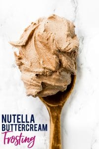 This creamy, dreamy Nutella Buttercream Frosting recipe is the frosting recipe you’ve been missing. It’ll easily replace your standard chocolate buttercream frosting recipe for anything you make. It’s great for spreading or piping on cupcakes, cakes, brownies, or cookies. You’ll love it! Recipe from @whattheforkblog | whattheforkfoodblog.com | easy homemade frosting recipes | how to make Nutella buttercream frosting | how to make frosting with Nutella | #Nutella #chocolate #frosting #dessert