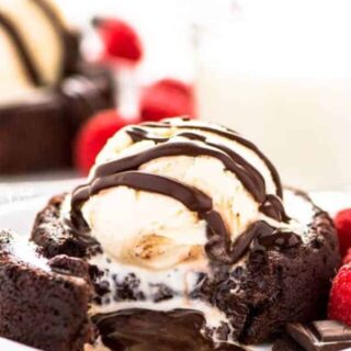 Super easy chocolate dessert recipe alert - gluten free chocolate lava cakes! Only a handful of ingredients needed, minimal prep, and minimal baking time. These are perfect for Valentine’s Day or any time that chocolate craving strikes! Serves 2 but the recipe can be doubled. Gluten Free dessert recipe from @whattheforkblog | whattheforkfoodblog.com | easy gluten free recipes | chocolate recipes | how to make chocolate lava cakes | small batch desserts | #glutenfree #chocolate #cake #dessert