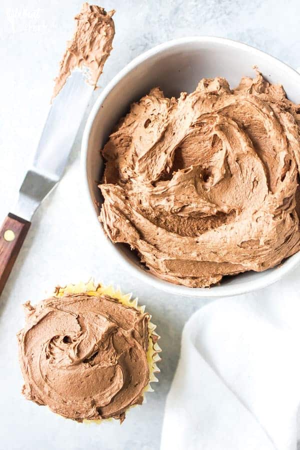 This creamy Homemade Chocolate Frosting recipe is easy to make and calls for simple ingredients. It’s great for spreading or piping on cupcakes, cakes, brownies, or cookies. You’ll love it! Recipe from @whattheforkblog | whattheforkfoodblog.com | easy homemade frosting recipes | how to make chocolate buttercream frosting | how to make frosting | the best chocolate frosting recipe | #buttercream #chocolate #frosting #dessert #easyrecipes