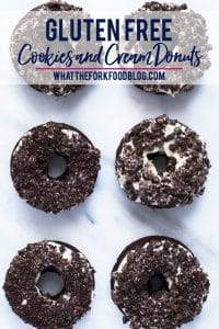 Gluten Free Cookies and Cream Donuts - a baked chocolate cake donut topped with a cream cheese icing and crushed chocolate sandwich cookies. A donut lover’s dream! Perfect for brunch, donut birthday parties, donut walls, or even a donut wedding cake! This recipe is easy to follow with a dairy free option. @whattheforkblog | whattheforkfoodblog.com | gluten free donut recipes | how to make baked donuts | homemade donuts | Oreo donuts | doughnuts #glutenfree #donuts #doughnuts #chocolate #Oreo
