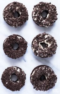 6 Yummy Gluten Free Cookies and Cream Donuts on a marble counter top