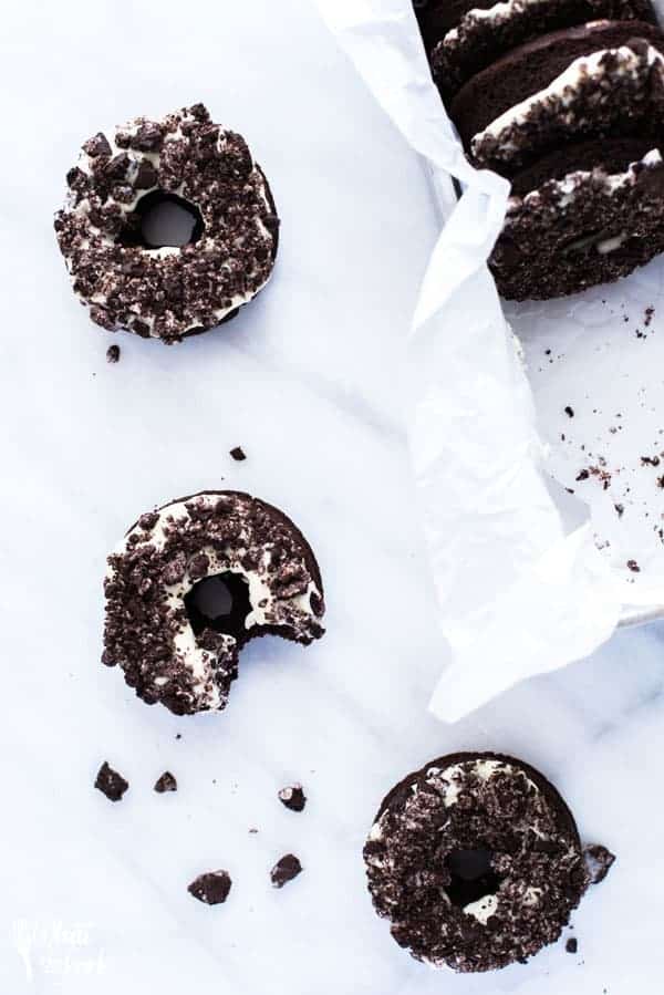 Gluten Free Cookies and Cream Donuts on counter with bite taken