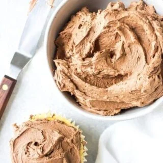 This creamy Homemade Chocolate Frosting recipe is easy to make and calls for simple ingredients. It’s great for spreading or piping on cupcakes, cakes, brownies, or cookies. You’ll love it! Recipe from @whattheforkblog | whattheforkfoodblog.com | easy homemade frosting recipes | how to make chocolate buttercream frosting | how to make frosting | the best chocolate frosting recipe | #buttercream #chocolate #frosting #dessert #easyrecipes