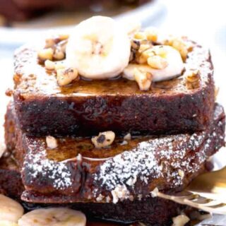 Did you make gluten free banana bread recently and have some leftover? Turn it into Banana Bread French Toast! It’s great for breakfast, brunch, or breakfast for dinner! Top it with some sliced bananas, chopped walnuts, and pure maple syrup. Recipe from @whattheforkblog | whattheforkfoodblog.com | gluten free breakfast recipes | recipes for brunch | how to make French Toast with quick bread | #brunch #breakfast #frenchtoast #glutenfree #bananabread #easyrecipes