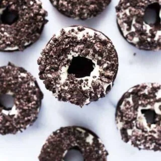 Tasty Gluten Free Cookies and Cream Donuts on counter, stacked high