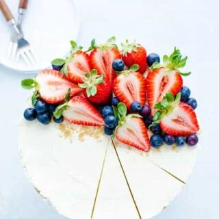 No Bake Cheesecake with fresh berries on a stand