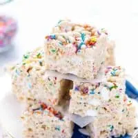 Gluten Free Cake Batter Rice Krispie Treats stacked on a blue plate