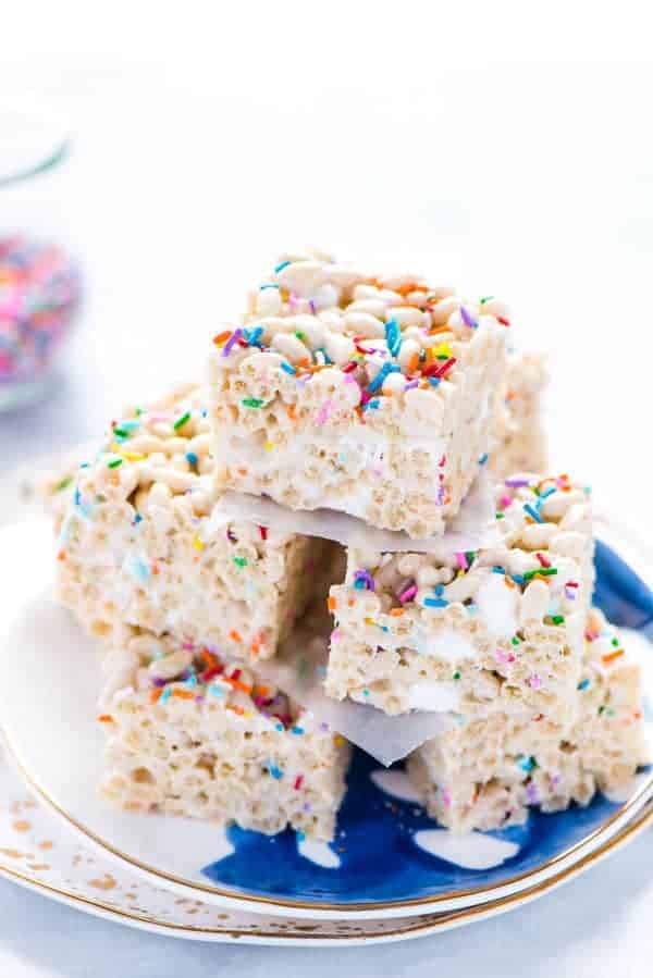 Gluten Free Cake Batter Rice Krispie Treats stacked on a blue plate