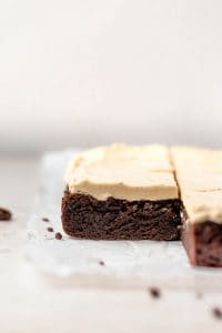 Looking to elevate your brownie experience? Try the gluten free brownies with peanut butter frosting! Rich, chewy, fudgy brownies topped with the creamiest, smoothest peanut butter frosting. It’s sure to satisfy that sweet tooth! For amazing more gluten Free dessert recipes visit @whattheforkfoodblog whattheforkfoodblog.com | #glutenfree #brownies #peanutbutter #chocolate #glutenfreedesserts #easyrecipes #frosting #buttercream #baking #glutenfreerecipe #glutenfreebaking