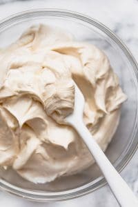 Make this homemade vanilla buttercream frosting recipe for cakes, cupcakes, cookies, and brownies! It’s easy to spread and pipes really well too! It’s so light and creamy, it’s like a buttercream cloud. This is definitely the best vanilla buttercream frosting recipe! From @whattheforkfoodblog - visit whattheforkfoodblog.com for more! #glutenfree #buttercream #frosting #vanilla #vanillabuttercream #vanillafrosting #cake #cupcakes #cakedecorating #recipe #easyrecipes