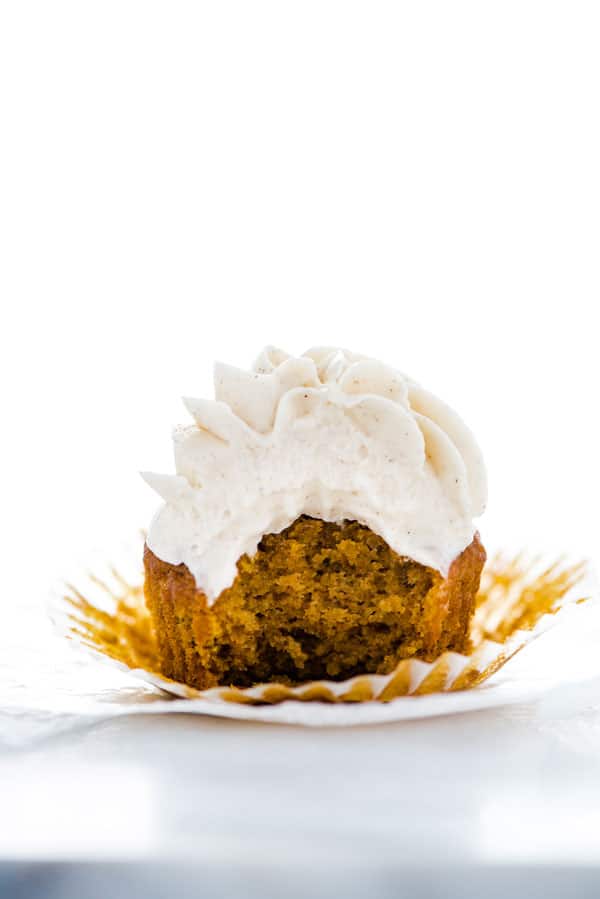 A classic fall dessert - gluten free pumpkin cupcakes! These are topped with an irresistible cinnamon cream cheese frosting. This easy cupcake recipe makes exactly one dozen with plenty of frosting for piping. Great for Halloween or Thanksgiving dessert tables! Easy gluten free dessert recipe from @whattheforkblog - visit whattheforkfoodblog.com for more! #glutenfree #baking #pumpkin #cupcakes #pumpkinrecipes #glutenfreebaking #easyrecipes #cupcakerecipe #dessert #fall #Halloween #Thanksgiving