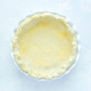 Unbaked Gluten Free Pie Crust in a white pie dish