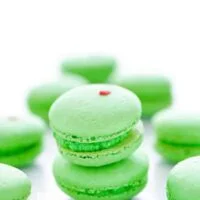 A short stack of green Grinch Heart French Macarons