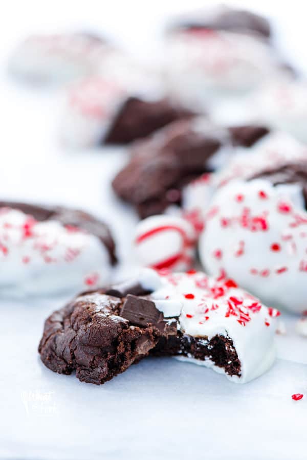 A gluten free triple chocolate peppermint cookie with a bite taken out