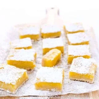 This is the best recipe for gluten free Meyer Lemon Bars! They're simple and easy to make and are tangy, citrusy, and gooey with an incredible shortbread crust! They’re perfect for Easter, baby showers, bridal showers, or any celebration. This easy recipe for lemon bars is one you have to try - they’re simply irresistible! Helpful post/guide includes lots of tips! Gluten Free Desserts recipe from @whattheforkblog - visit whattheforkfoodblog.com for more! #glutenfree #lemon #MeyerLemon #desserts