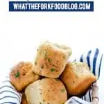 Soft, yeasty gluten free rolls made with garlic and herbs! These rolls are easy to make and have an amazing texture you wouldn’t believe until you try it! These gluten free dinner rolls truly are a revolutionary gluten free bread product. Serve them with holiday meals, Sunday dinner, or even with weeknight dinners. Gluten free bread recipe from @whattheforkblog - visit whattheforkfoodblog.com for more #glutenfree #glutenfreebread #glutenfreebaking #bread #yeastrolls #glutenfreerecipes #rolls