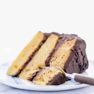 This gluten free yellow cake recipe from scratch is unlike any homemade yellow cake you’ve had! Homemade yellow cake is notorious for being dry - not this one! It’s moist and it’s hands down, the best yellow cake recipe I’ve ever made. An easy yellow cake recipe is one you need in your arsenal for the ultimate birthday cake or for any celebration. Gluten Free cake recipe from @whattheforkfoodblog - visit whattheforkfoodblog.com for more! #glutenfree #glutenfreecake #yellowcake #glutenfreerecipe