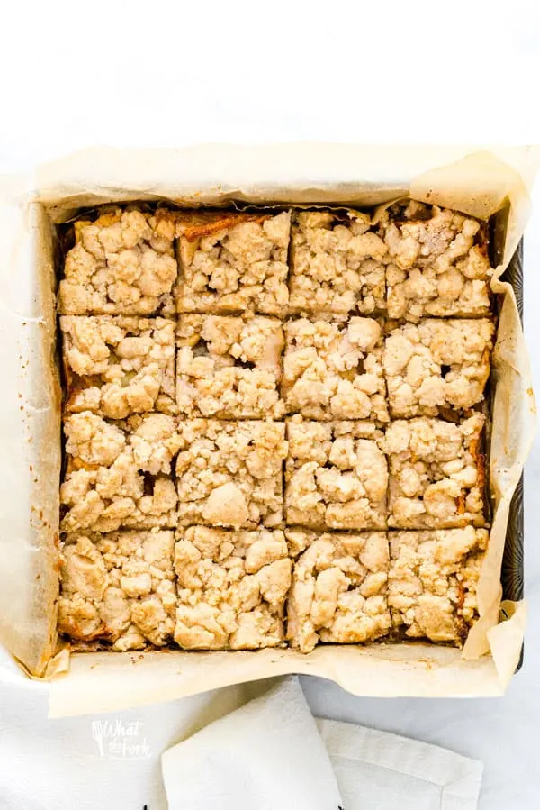 Sliced Gluten Free Apple Pie Bars in an 8x8 baking pan