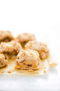 Sliced Gluten Free Apple Pie Bars on unbleached parchment paper