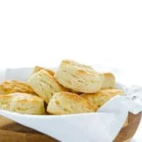 This is the best recipe for gluten free buttermilk biscuits! These biscuits are light, fluffy, with amazing flavor and texture. They've got a nice crisp bottom and beautifully browned top. If you've been missing true biscuits since starting a gluten free diet, this is the recipe you need to try! This post is full of gluten free baking tips plus a recommendation for the best gluten free flour blend for these biscuits. #glutenfree #biscuits #glutenfreebiscuits #glutenfreebaking #glutenfreerecipes