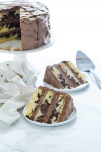 This is the best recipe for homemade gluten free marble cake! It's a moist, 3 layer vanilla cake swirled with chocolate cake batter. It's the perfect combination of chocolate and vanilla, perfect for indecisive dessert eaters! This is a stunning cake for any occasion - birthday cake, wedding cake, anniversary cake, baby shower, or bridal shower! Gluten Free Cake recipe from @whattheforkblog -visit whattheforkfoodblog.com for more gluten free desserts #glutenfree #cake #marblecake #glutenfreecake